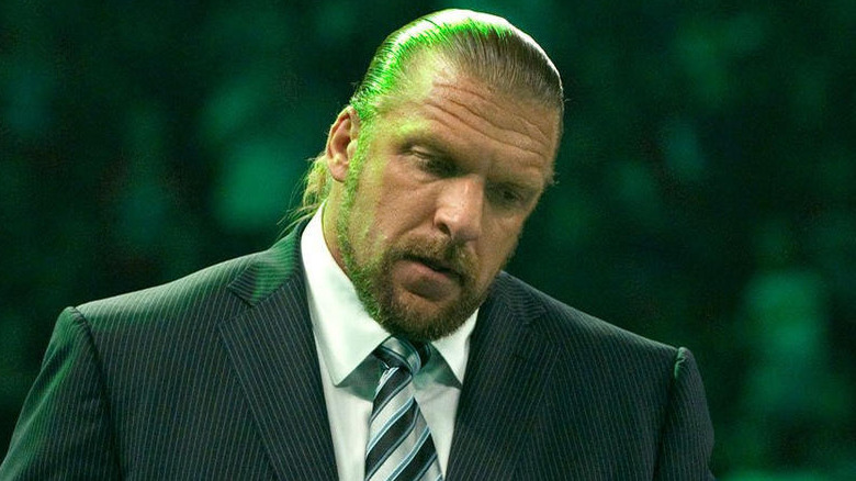 Triple H stands at an event
