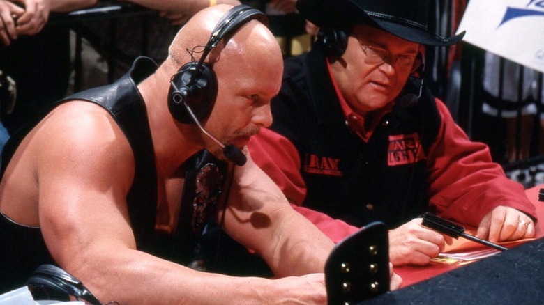 "Stone Cold" Steve Austin and Jim Ross at the WWE commentary table.