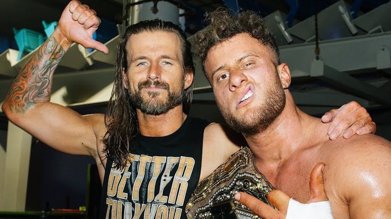 Adam Cole and MJF posing