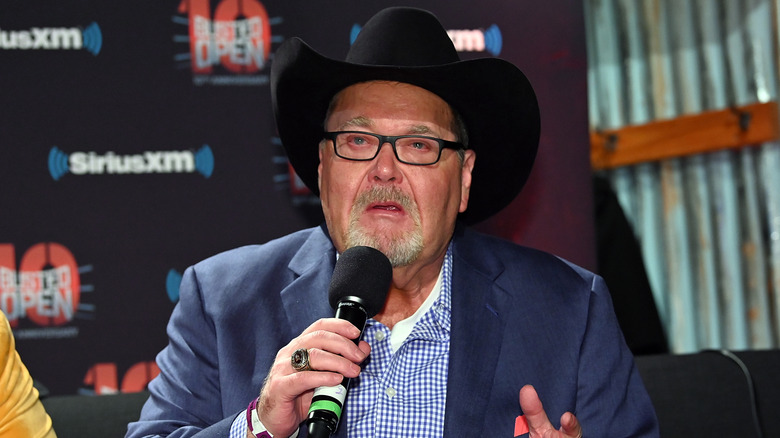 Jim Ross holding a microphone at a SiriusXM event