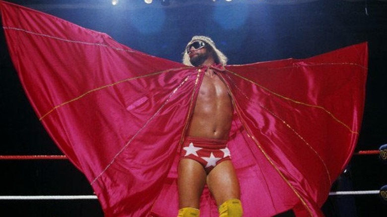 Randy Savage extends cape