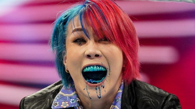 Asuka dripping blue liquid from her mouth