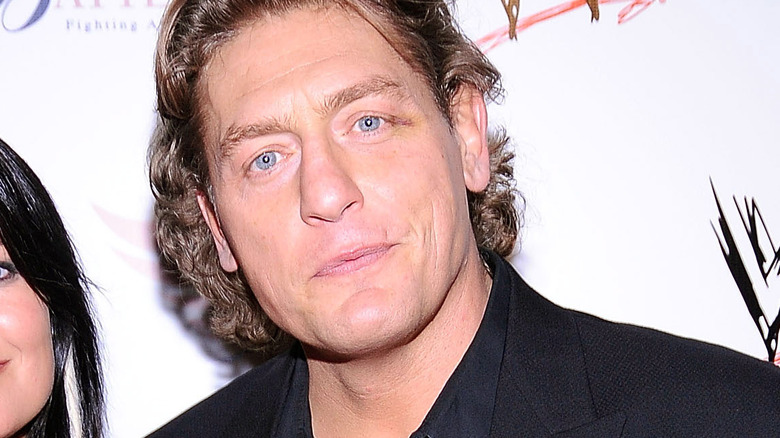 William Regal looking at a camera