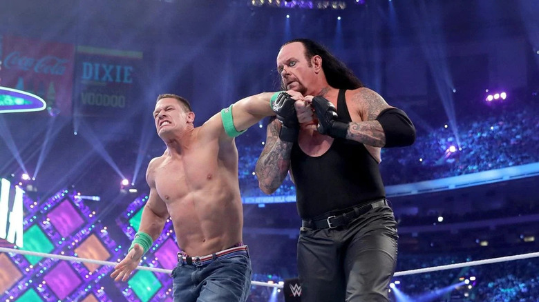 John Cena being beaten up by the Undertaker