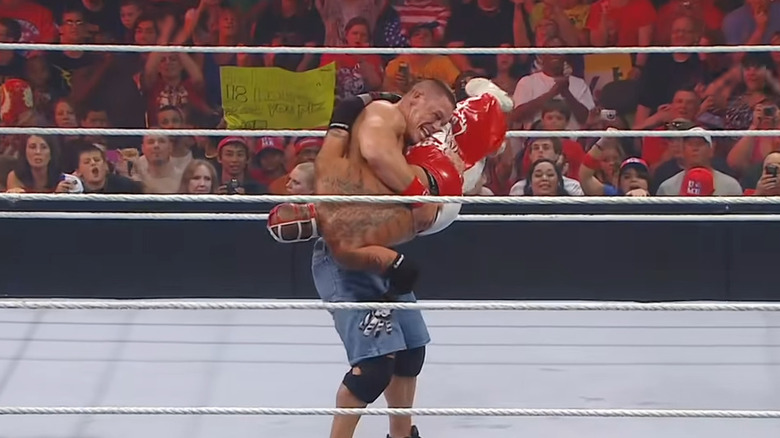 Cena holds Rey Mysterio 