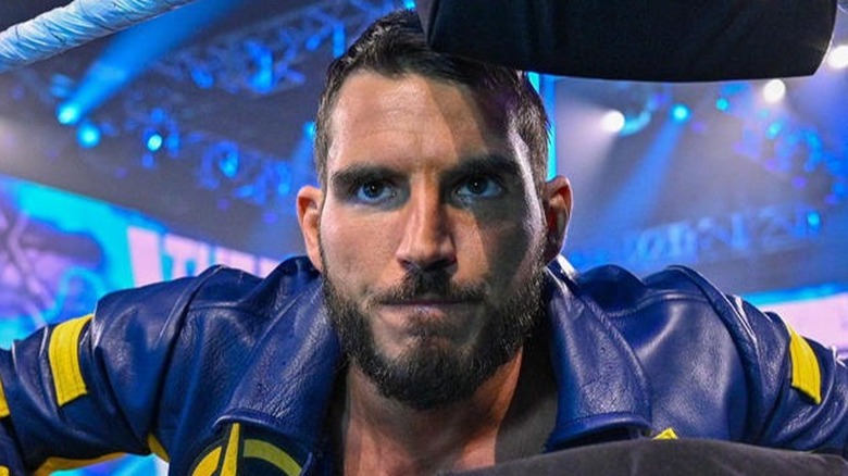 Johnny Gargano posing in the turnbuckles 