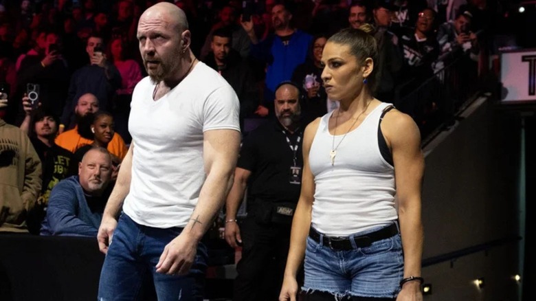 Jon Moxley stands beside Marina Shafir before heading to the ring from the crowd on "AEW Dynamite."