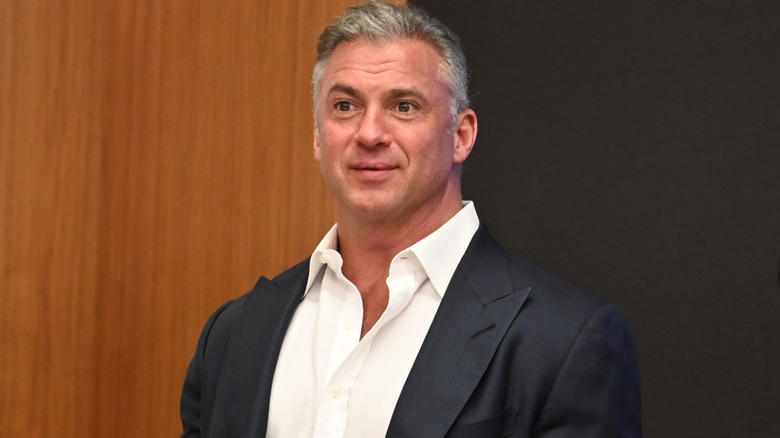 Shane McMahon wearing a black suit coat