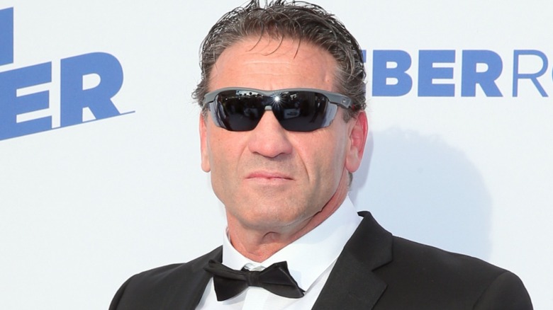 Ken Shamrock rocking a bowtie and sunglasses