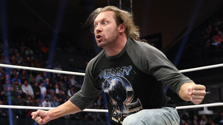 Kenny Omega looks from the ring to the stage in exasperation during a segment on 