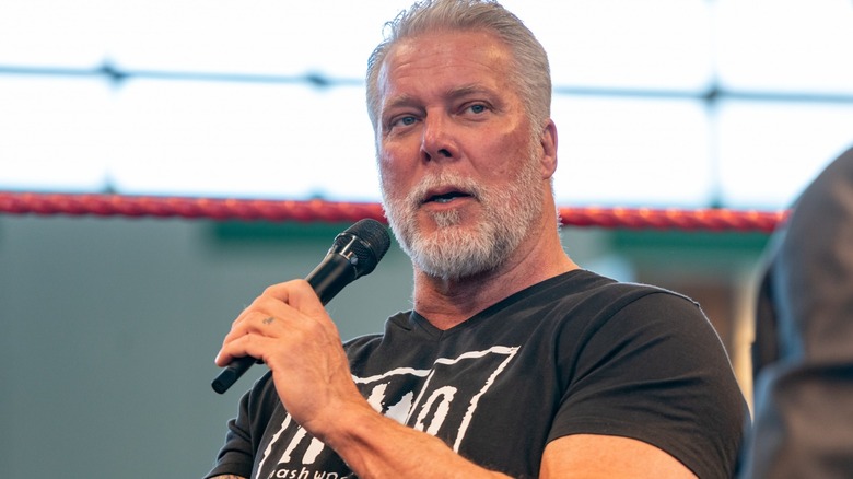 Kevin Nash holding his mic