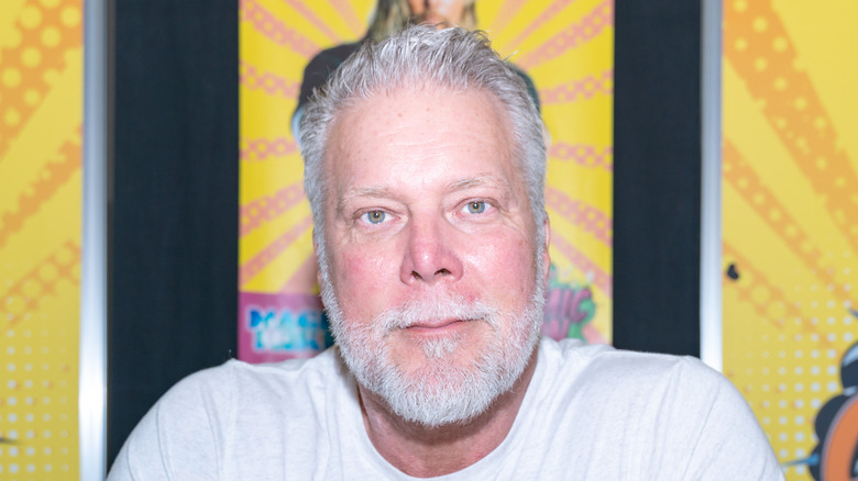 Kevin Nash, waiting to give you his autograph