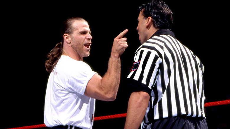 Shawn Michaels pointing to referee in wrestling ring