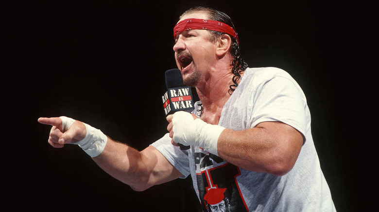 Terry Funk speaking into a "Raw is War" microphone
