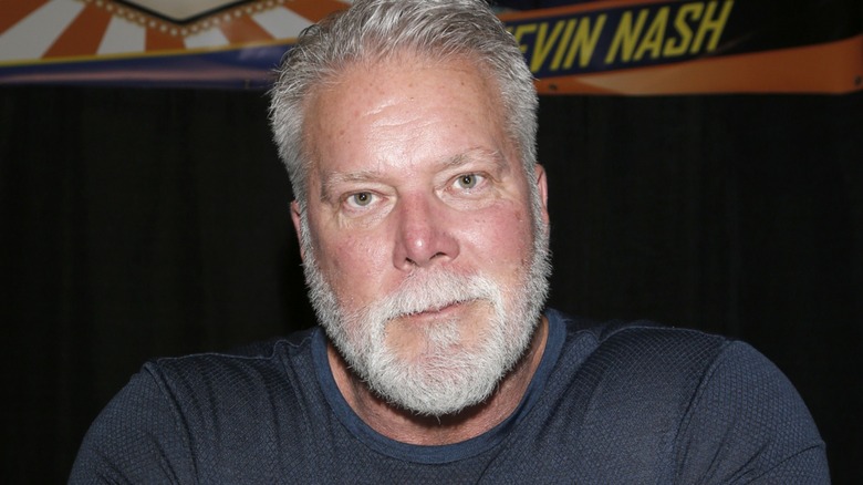 Kevin Nash waiting to give his autograph