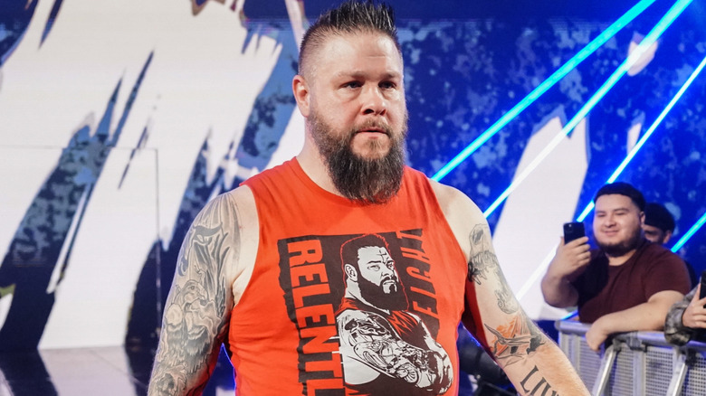 Kevin Owens is wearing a red tanktop.