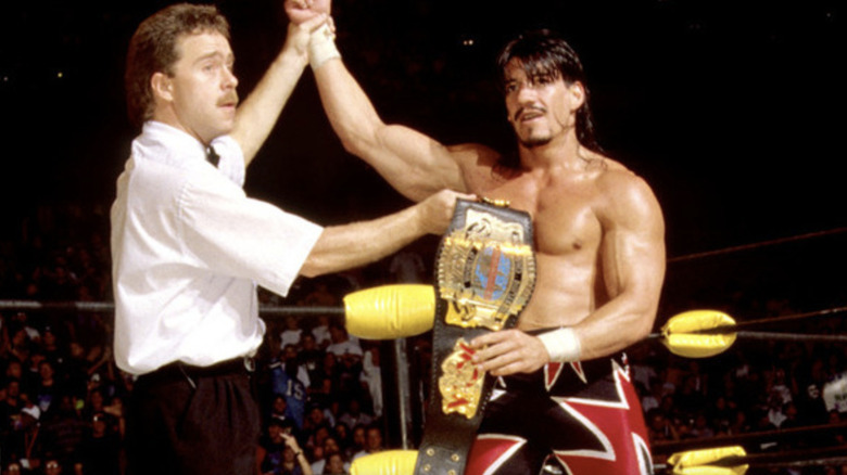 Eddie Guerrero holding the title