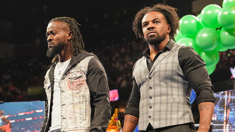 The New Day standing in the ring