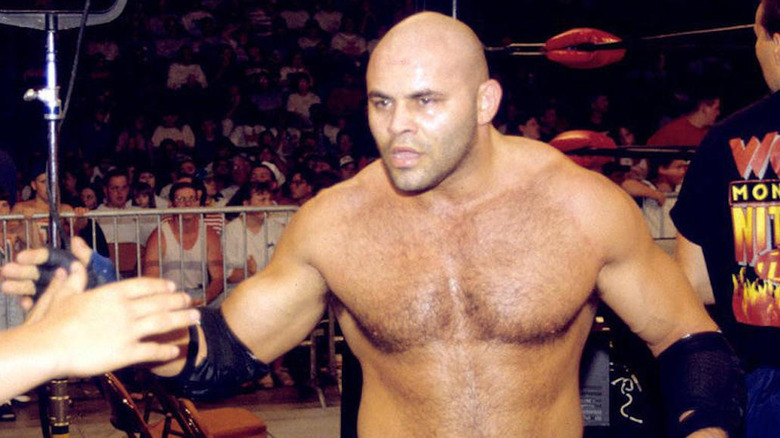 Konnan greets fans after a match