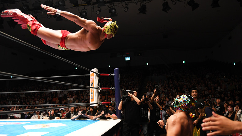 Dragon Lee dives onto Titan in NJPW