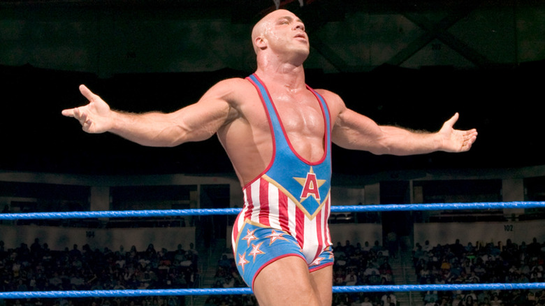 Kurt Angle poses in a WWE ring