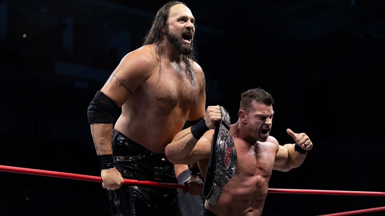 Lance Archer and Brian Cage posing in the ring