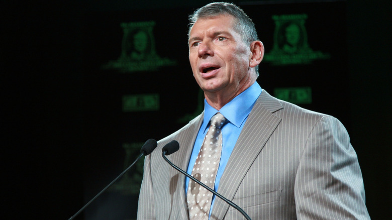 Vince McMahon addresses the crowd during a conference event