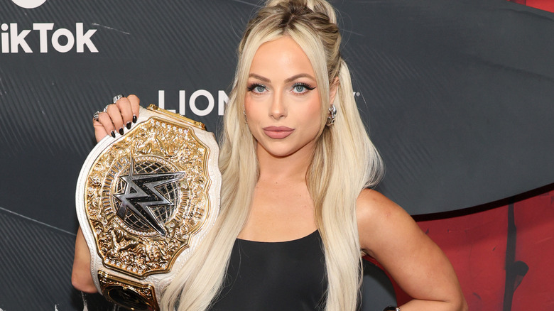 Liv Morgan holding the WWE Women's World Championship