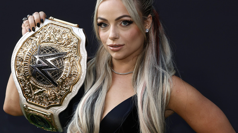 Liv Morgan poses with title