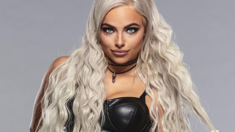 Liv Morgan poses backstage with a revamped look for a WWE.com photoshoot.