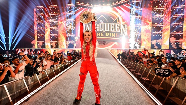 Liv Morgan holds up her newly-won Women's World Championship on the ramp at King & Queen of the Ring in Saudi Arabia.