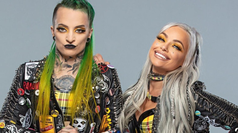 Ruby Riott poses alongside Liv Morgan during their reunion as the Riott Squad for a backstage photoshoot in WWE.