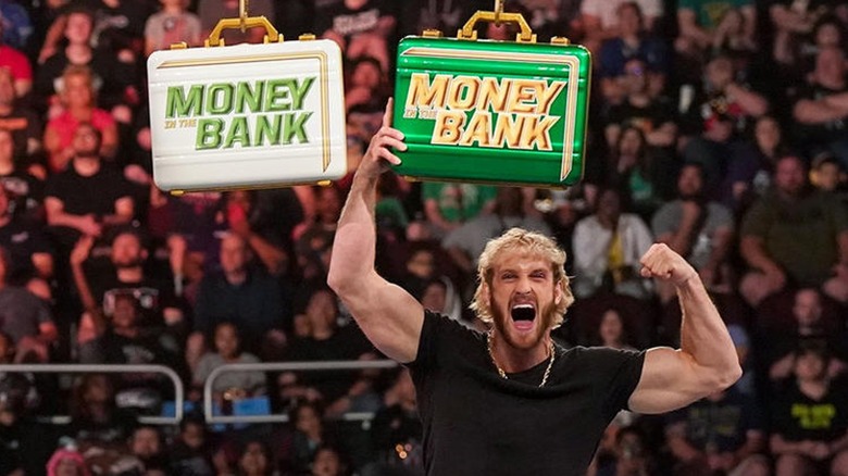 Logan Paul Poses With The MITB Briefcases