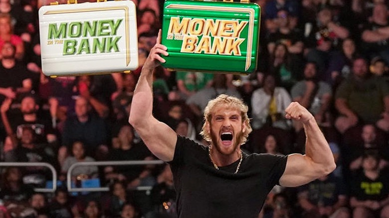Logan Paul Poses With The MITB Briefcases