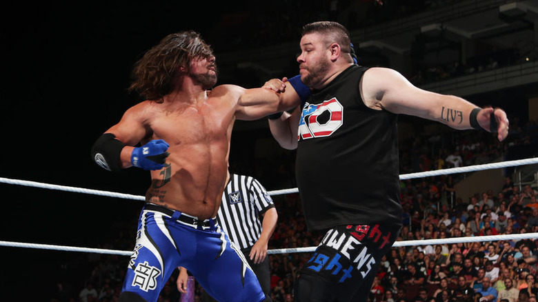 AJ Styles punching Kevin Owens