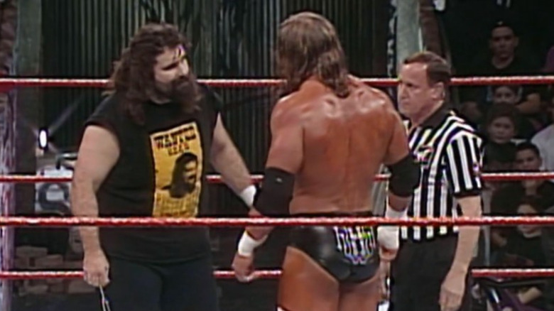 Cactus Jack and HHH stare down