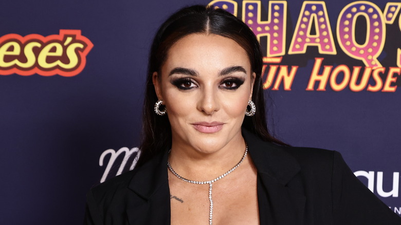 Deonna Purrazzo poses on a red carpet