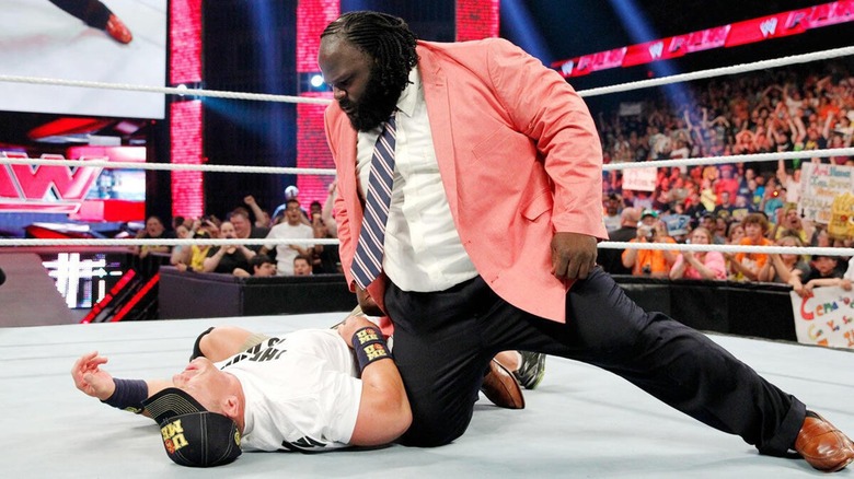 John Cena (on the ground) and Mark Henry
