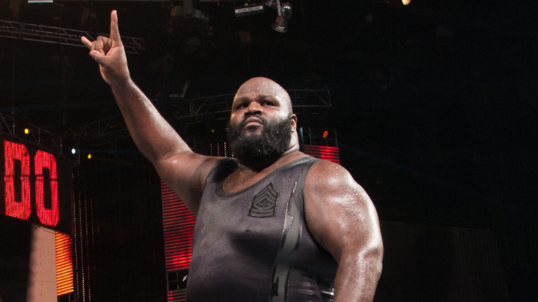 Mark Henry throws up the Texas horns salute.