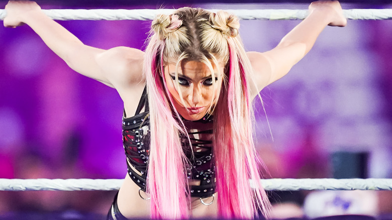 Alexa Bliss stretches on the ropes at WWE Royal Rumble 2023.