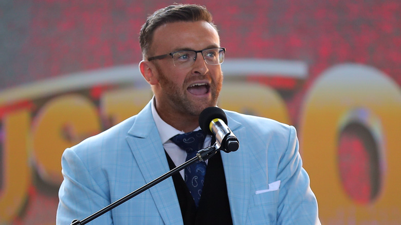 Nick Aldis in glasses