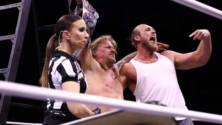 Chris Jericho celebrating ROH World Championship victory with Aubrey Edwards and Big Bill