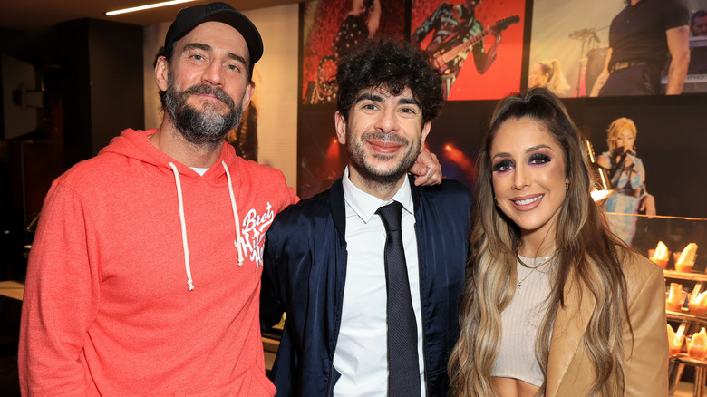 Tony Khan poses with CM Punk and Britt Baker