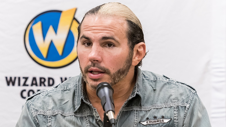 Matt Hardy responds to an audience member's question at a panel event