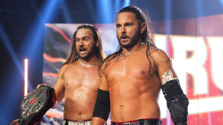 The Young Bucks holding title belts