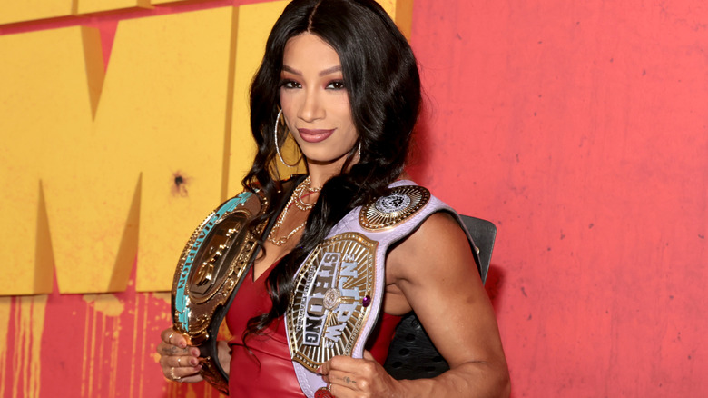 Mercedes Mone carries the NJPW Strong Women's and AEW TBS Championships