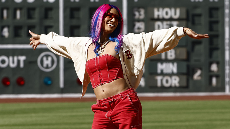 Mercedes Mone posing at a baseball stadium