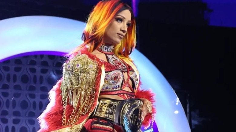 Mercedes Mones heads down the ramp wearing her TBS Championship belt around her waist.