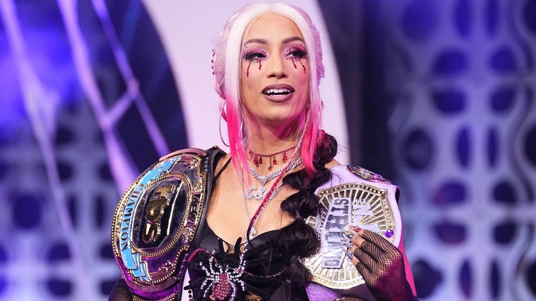 Mercedes Mone holding the TBS and NJPW STRONG Women's Championships