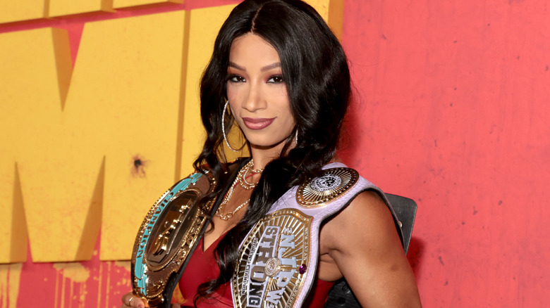 Mercedes Mone holding the TBS and NJPW STRONG Women's Championships